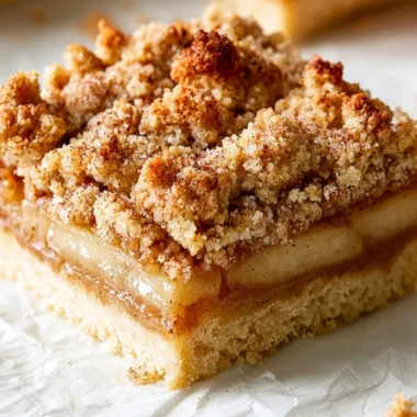 Delicious homemade apple crisp bars topped with a buttery crumble and fresh apples.