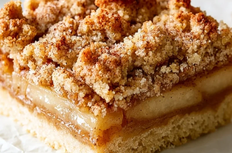 Delicious homemade apple crisp bars topped with a buttery crumble and fresh apples.