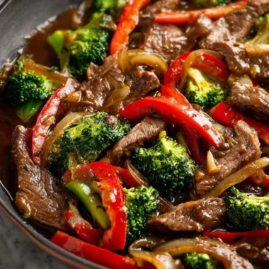 Colorful beef stir fry with vegetables in a skillet