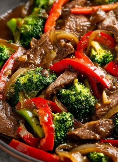 Colorful beef stir fry with vegetables in a skillet
