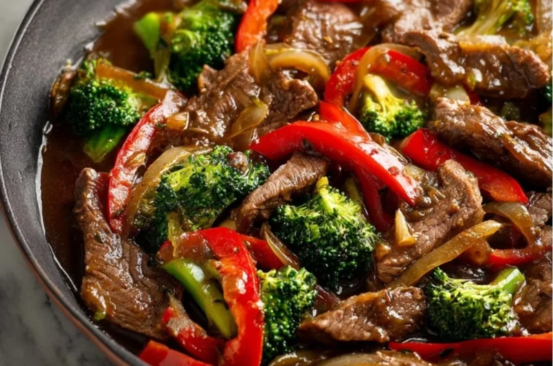 Colorful beef stir fry with vegetables in a skillet