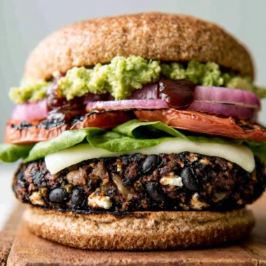 Delicious homemade black bean burgers on a wooden serving platter