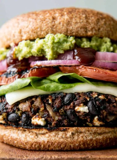 Delicious homemade black bean burgers on a wooden serving platter