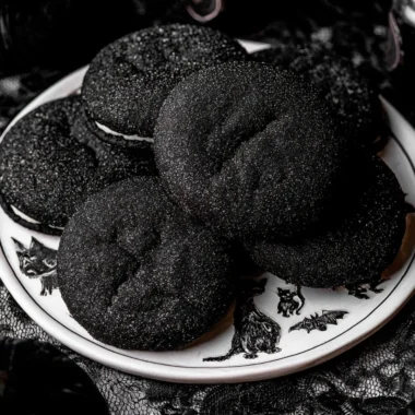 Black Velvet Cheesecake Cookies with cream cheese frosting on a plate