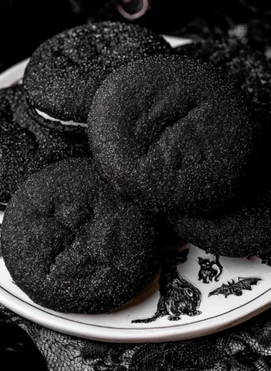 Black Velvet Cheesecake Cookies with cream cheese frosting on a plate