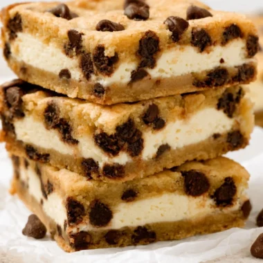 Chocolate chip cheesecake stuffed cookies on a baking tray