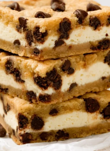 Chocolate chip cheesecake stuffed cookies on a baking tray