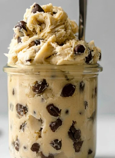 Bowl of edible chocolate chip cookie dough for one with chocolate chips