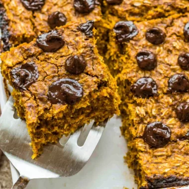 Delicious pumpkin baked oatmeal with chocolate chips in a cozy fall setting