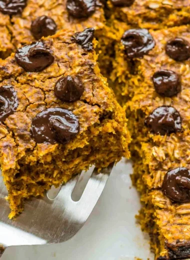 Delicious pumpkin baked oatmeal with chocolate chips in a cozy fall setting