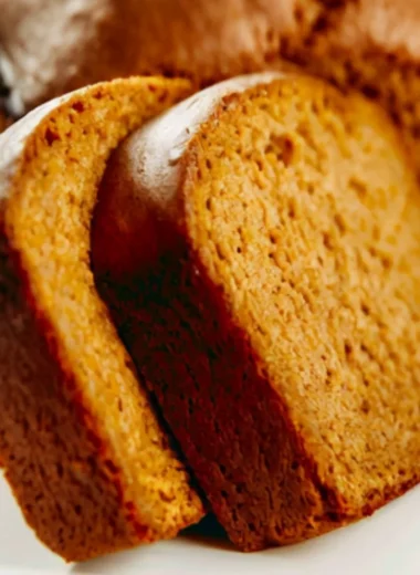 Freshly baked Libby's pumpkin bread with a slice cut out, showcasing its moist texture.