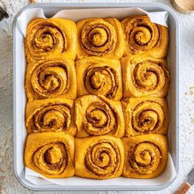Deliciously baked Pumpkin Cinnamon Rolls with cream cheese frosting