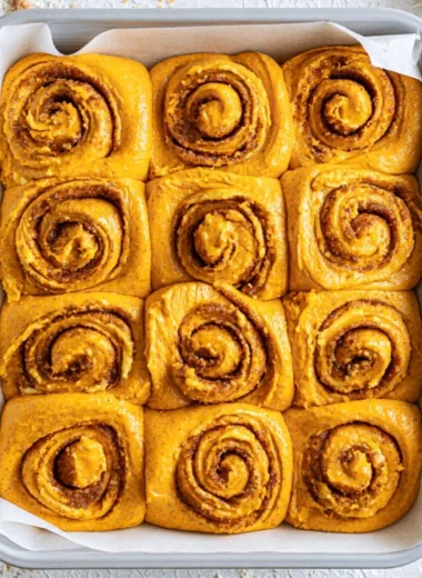 Deliciously baked Pumpkin Cinnamon Rolls with cream cheese frosting