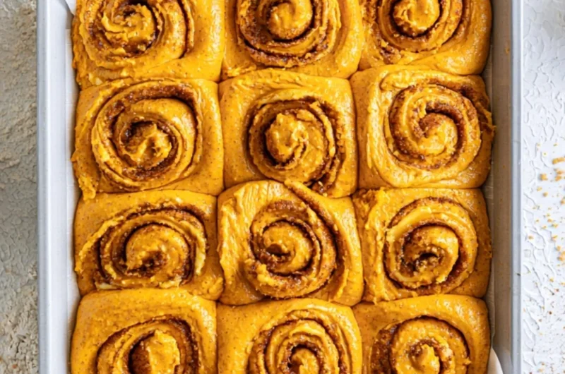 Deliciously baked Pumpkin Cinnamon Rolls with cream cheese frosting