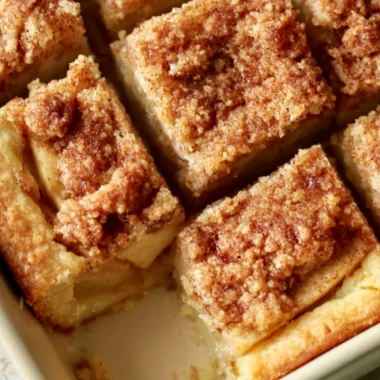 Delicious homemade apple pie bars with warm cinnamon and apple filling
