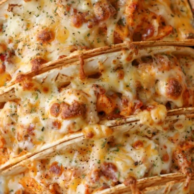 Baked chicken tacos with bacon and ranch dressing in a crispy shell
