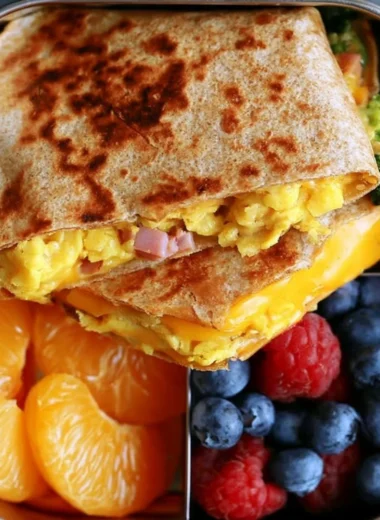 Delicious breakfast quesadilla filled with cheese, eggs, and veggies.