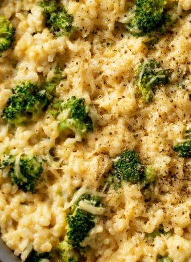 Bowl of easy broccoli cheese rice with melted cheese and broccoli florets