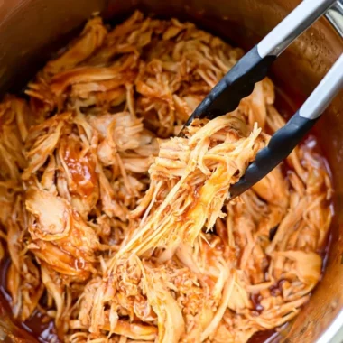 Delicious Instant Pot BBQ chicken served on a plate with sauce
