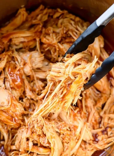 Delicious Instant Pot BBQ chicken served on a plate with sauce