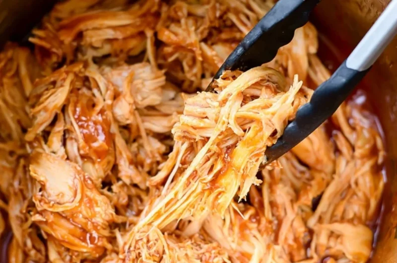 Delicious Instant Pot BBQ chicken served on a plate with sauce