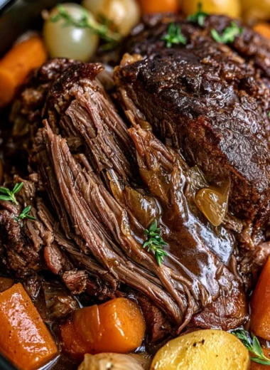 Delicious Crockpot pot roast with vegetables in a slow cooker.