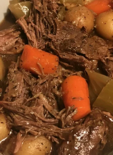 Easy slow cooker pot roast with vegetables in a serving dish