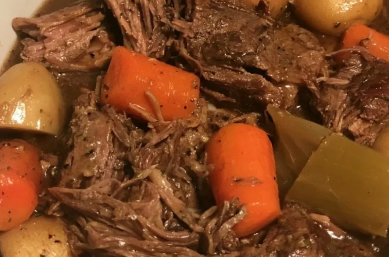 Easy slow cooker pot roast with vegetables in a serving dish
