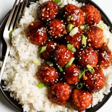 Delicious Honey Garlic Meatballs served with a glaze and garnished with green onions