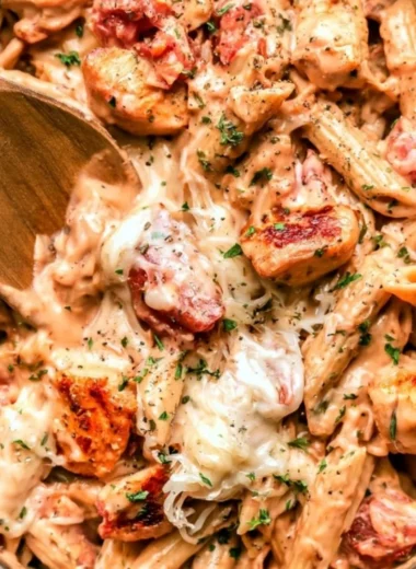 One pot chicken pasta dish garnished with herbs and served in a bowl
