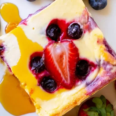 Delicious baked yogurt dessert topped with fruit and nuts
