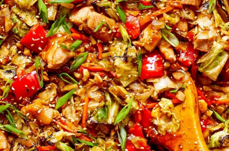 Colorful cabbage stir fry served in a bowl with vegetables