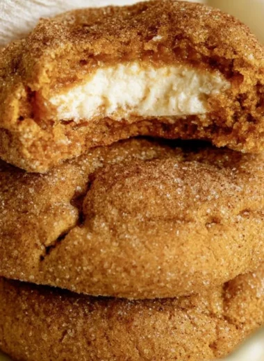 Chewy pumpkin cheesecake cookies on a platter, perfect for autumn baking.