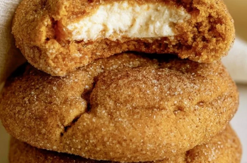 Chewy pumpkin cheesecake cookies on a platter, perfect for autumn baking.