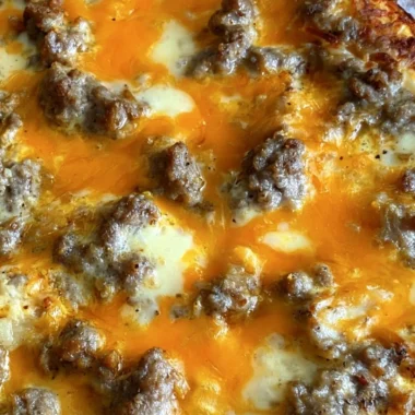 Delicious Christmas Morning Casserole topped with cheese and herbs.