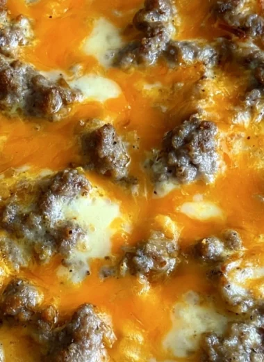 Delicious Christmas Morning Casserole topped with cheese and herbs.