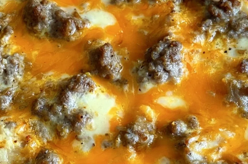 Delicious Christmas Morning Casserole topped with cheese and herbs.