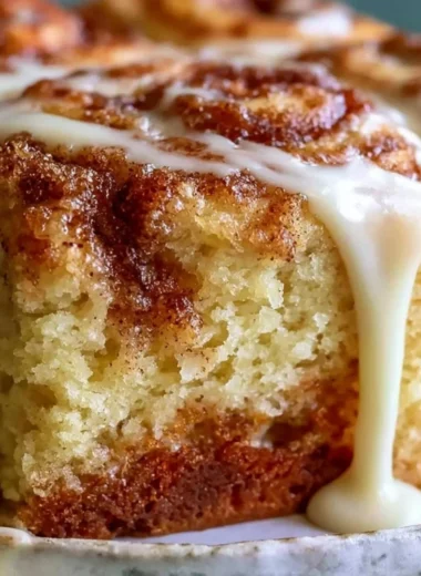 Delicious Cinnabon Cinnamon Roll Cake showcasing its cinnamon swirl and frosting