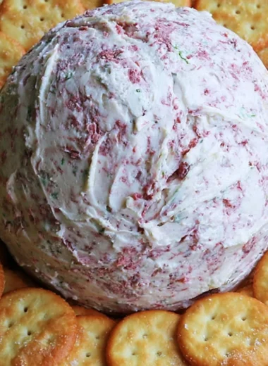 Easy party cheese ball served on a platter with crackers and vegetables