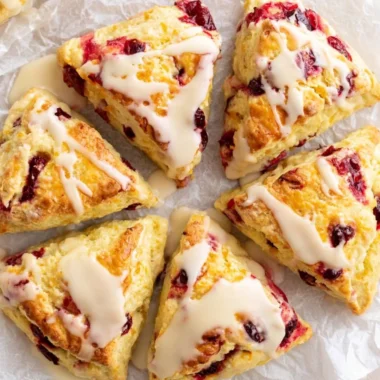 Freshly baked cranberry orange scones with cranberries and orange zest.